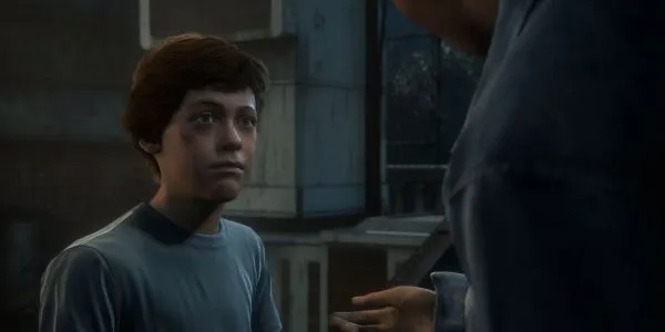 『アンチャーテッド 4』で弟を見つめる若いネイサン・ドレイク